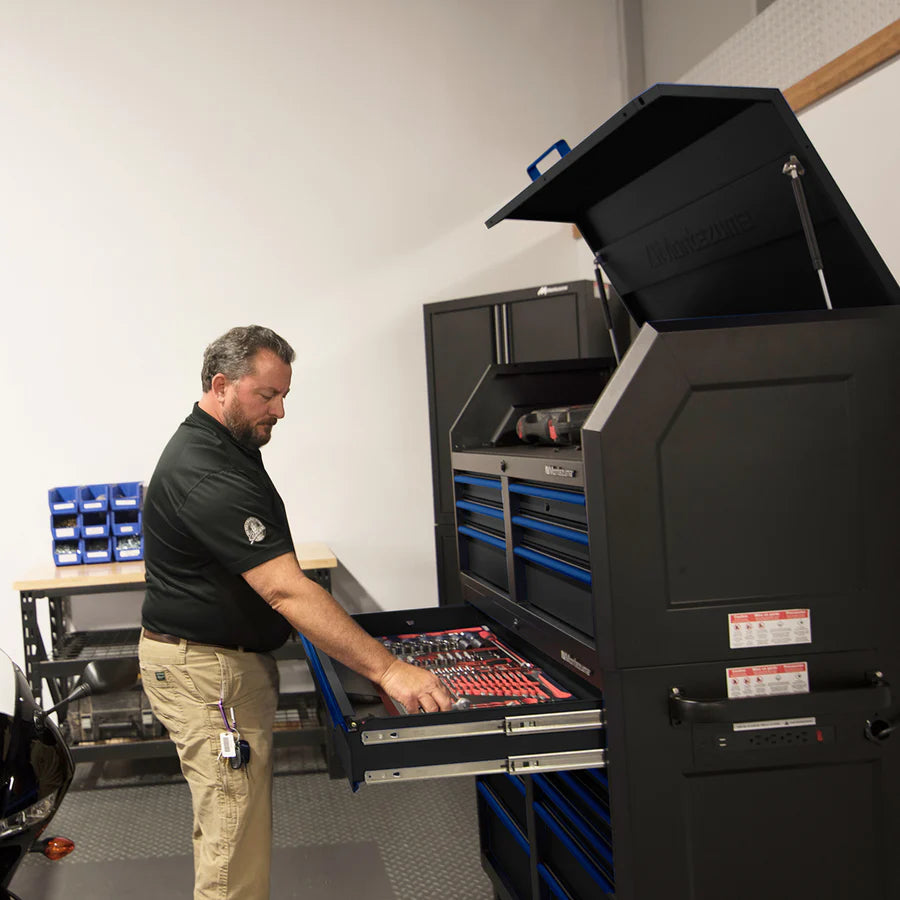 46 x 24 in. 11-Drawer Tool Cabinet with tool chest drawer open, in use